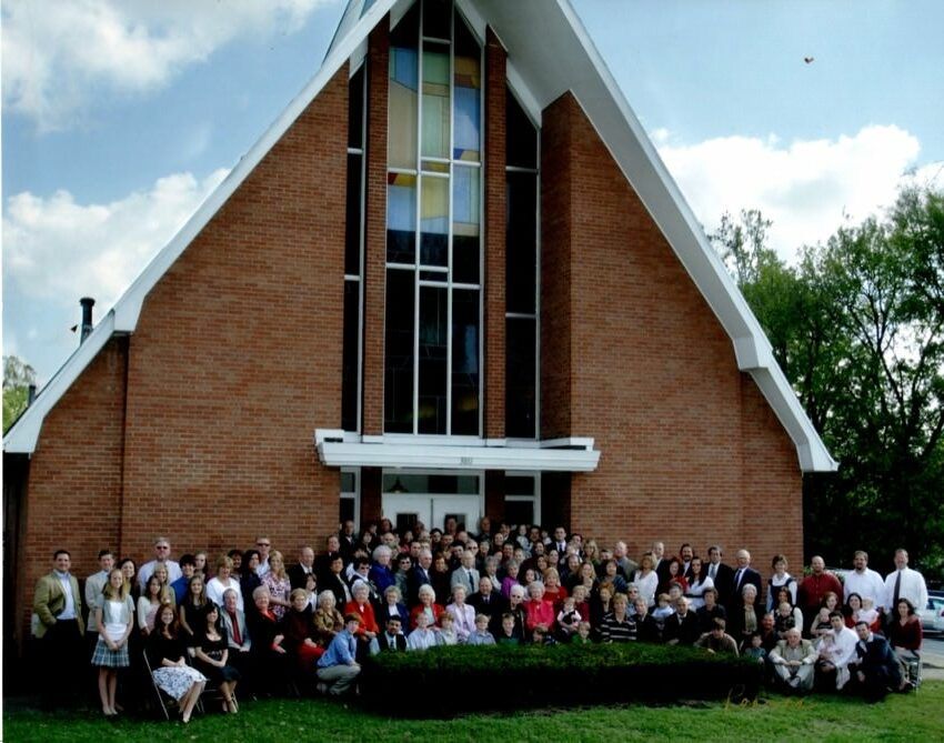 Bethel congregation in front of the church's previous building on Gallatin Road