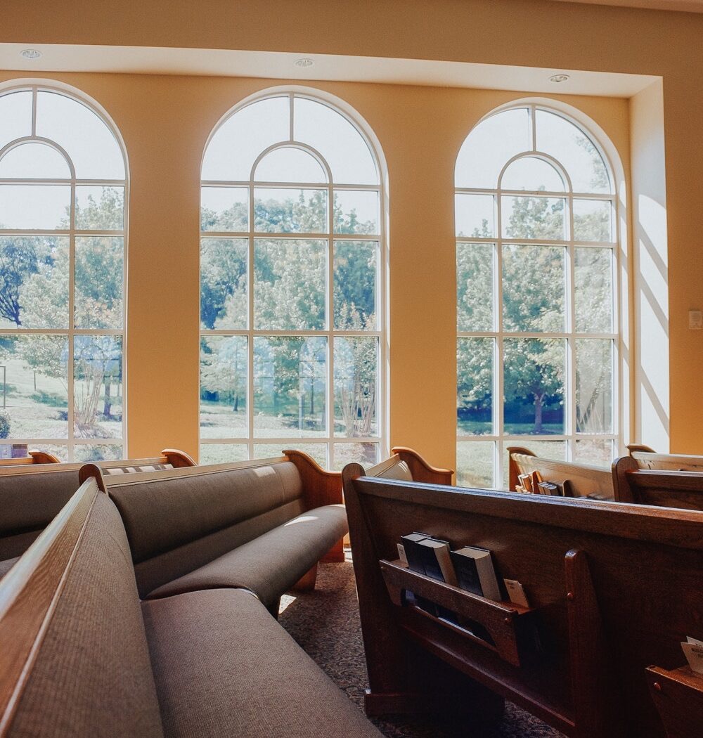 Pews and arched windows inside the Bethel sanctuary